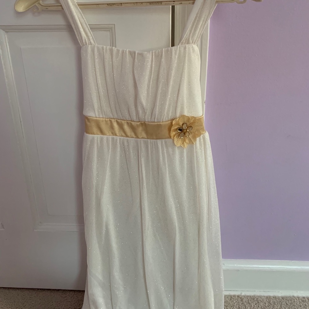 White sleeveless dress with gold sparkles